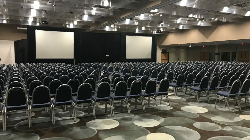 Photo of chairs lined up for a large event